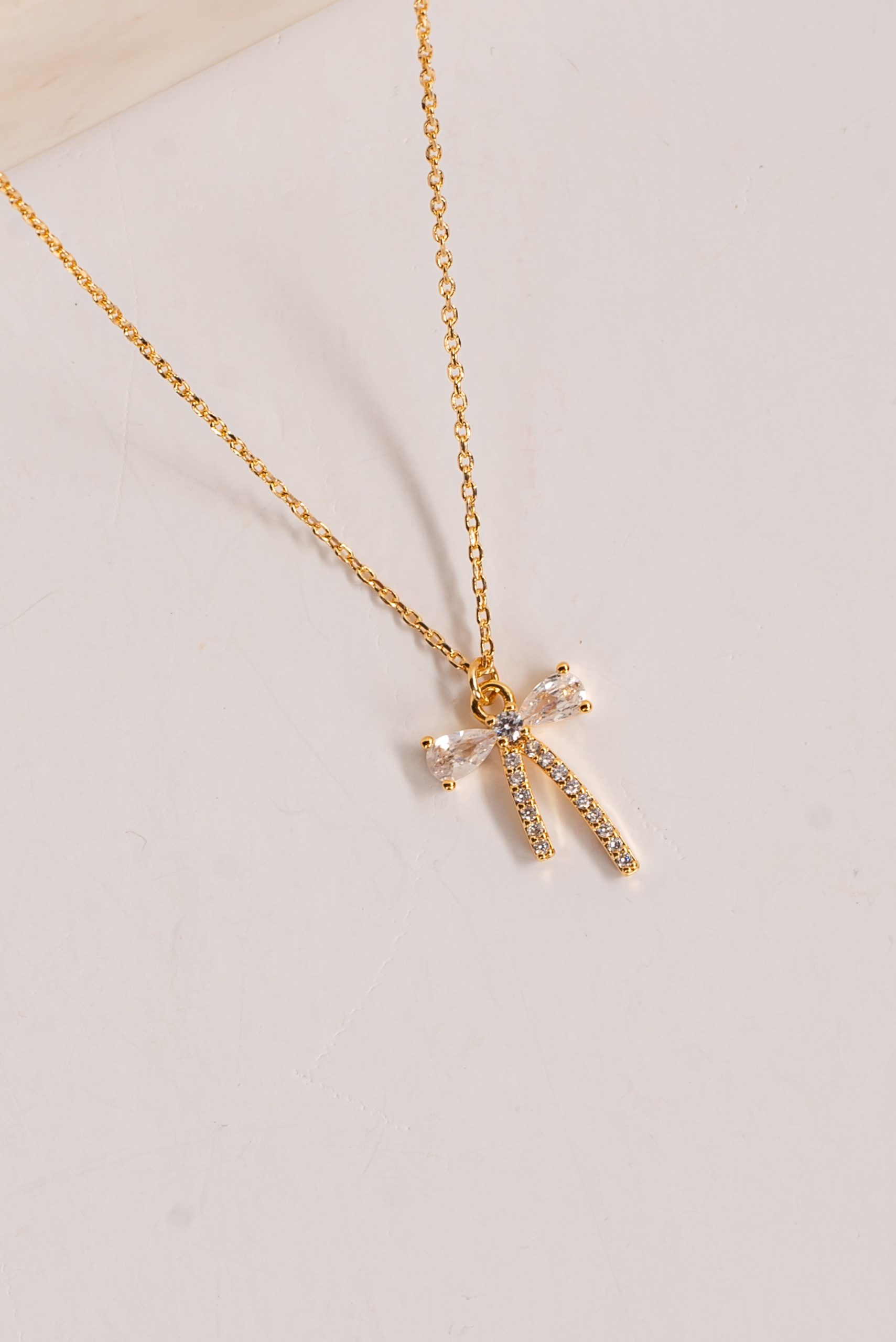 shopdressup_gold_rhinestone_bow_charm_necklace-2.jpg